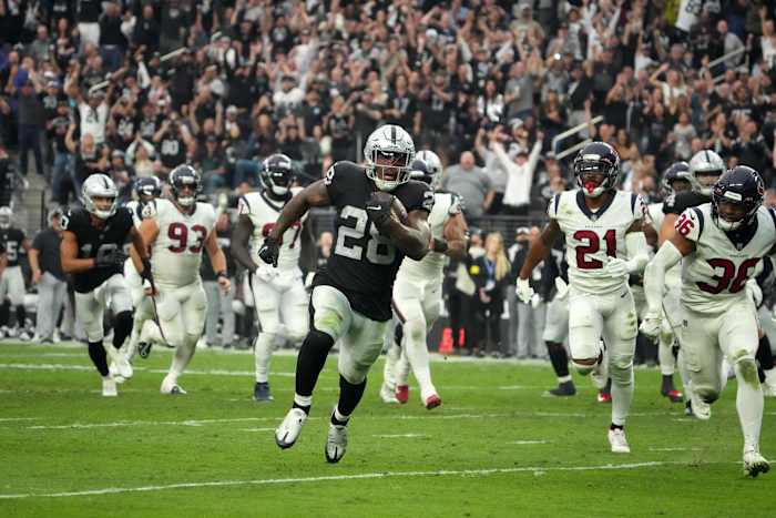 Las Vegas Raiders running back Josh Jacobs (28) scores on a 15-yard touchdown run in the fourth quarter against the Houston Texans. Mandatory Credit: Kirby Lee-USA TODAY Sports